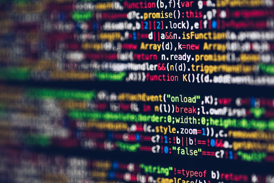 A photograph of a computer screen displaying lines of HTML code with syntax highlighting in various colors, including blue, orange, and green. The code defines the structure of a webpage, with element
